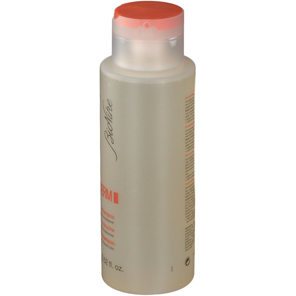BioNike Triderm Dusch-Shampoo. Flacone, vista laterale. Liquido trasparente. Tappo arancione. Etichetta prodotto.