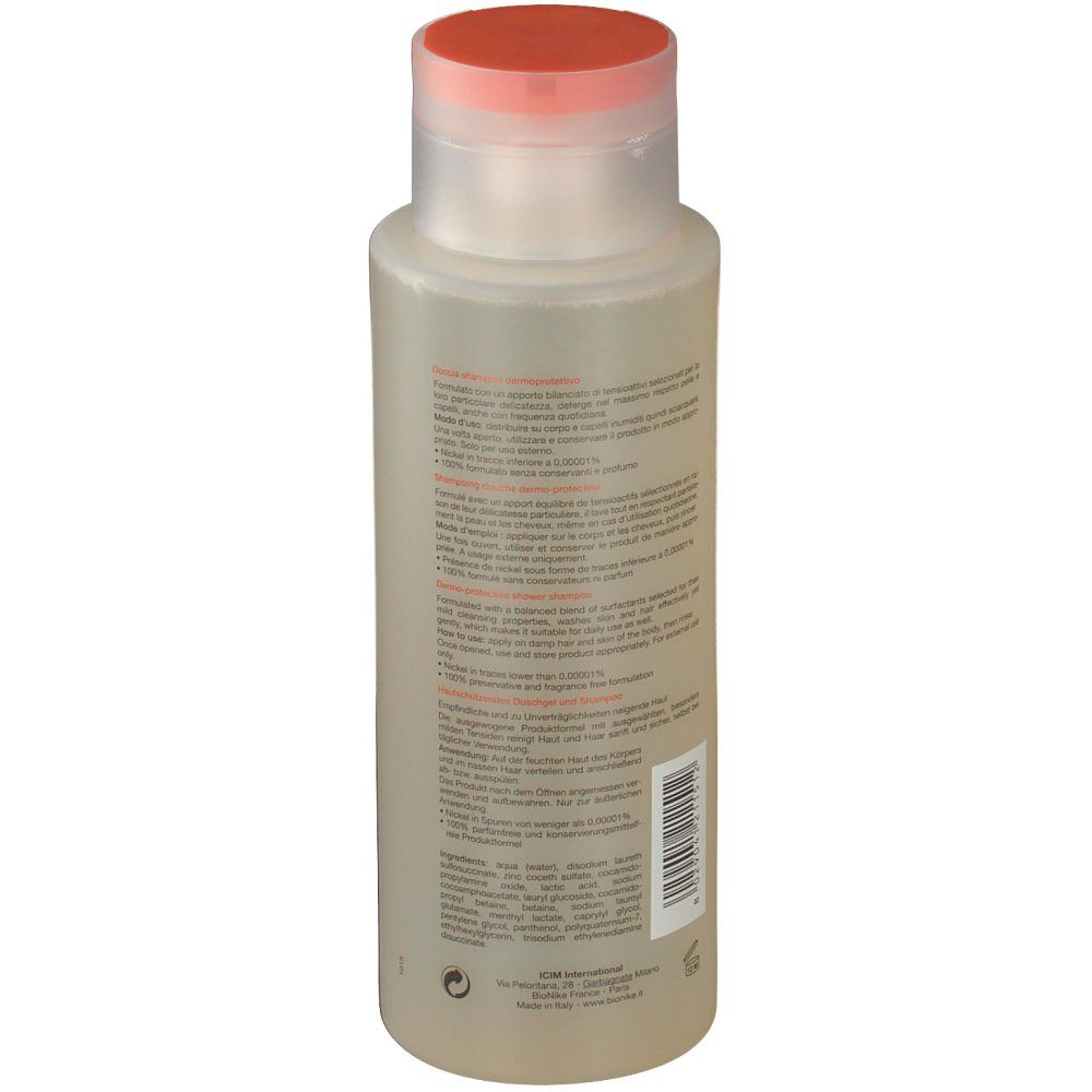 BioNike Triderm Dusch-Shampoo. Retro del flacone. Informazioni testuali sull'etichetta. Liquido trasparente. Tappo arancione.