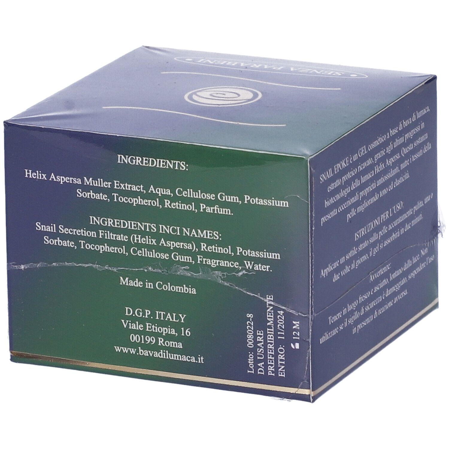 Scatola verde scuro con elenco ingredienti: Helix Aspersa Muller Extract, Aqua, Cellulose Gum, etc. Prodotto in Colombia. Indirizzo.