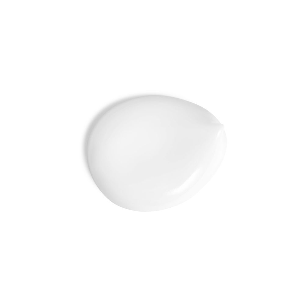 Goccia di latte solare bianco su sfondo bianco. Forma rotonda con una punta.