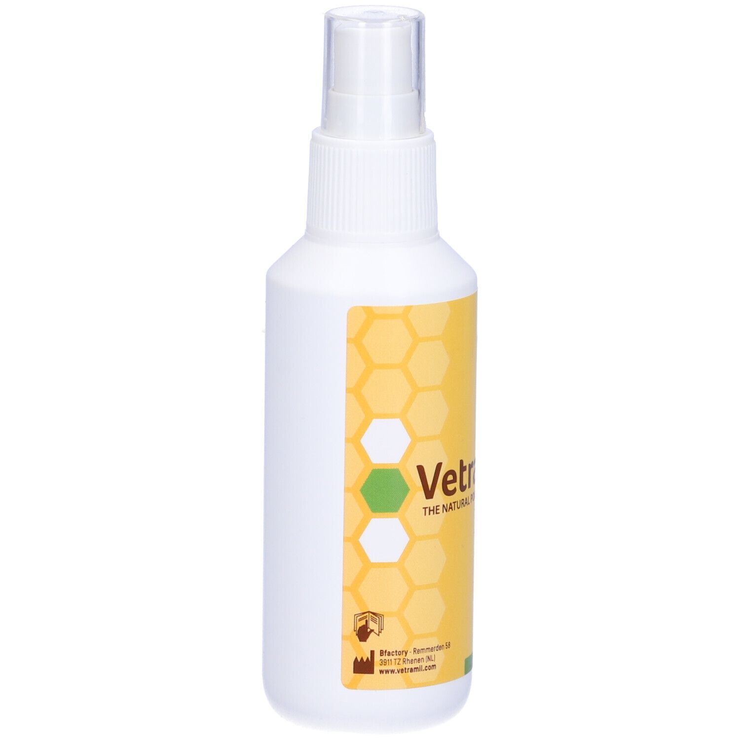 Flacone spray bianco con etichetta gialla. Scritta: Vetramil. Design a nido d'ape. Testina spray trasparente.