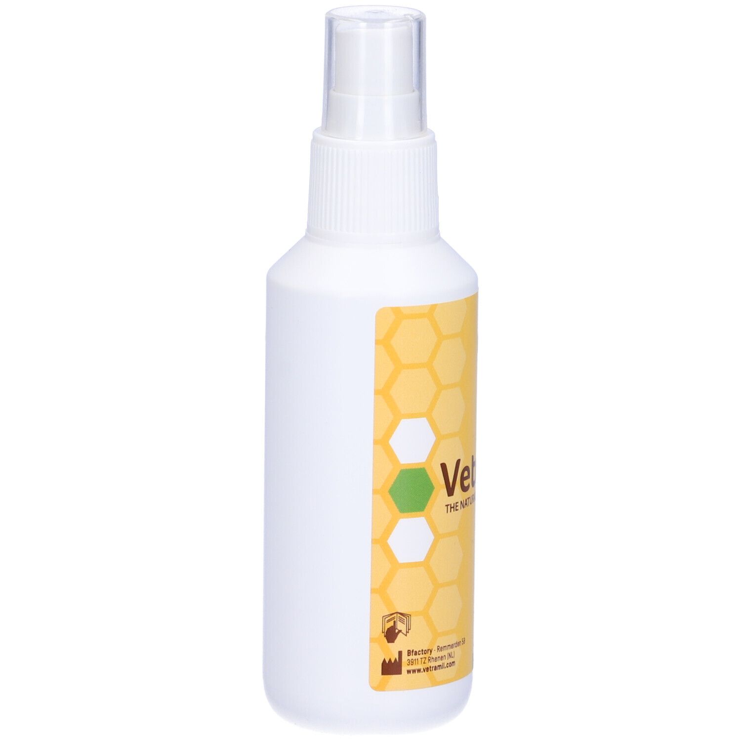 Flacone spray bianco con etichetta gialla. Scritta: Vetramil. Design a nido d'ape. Testina spray trasparente.