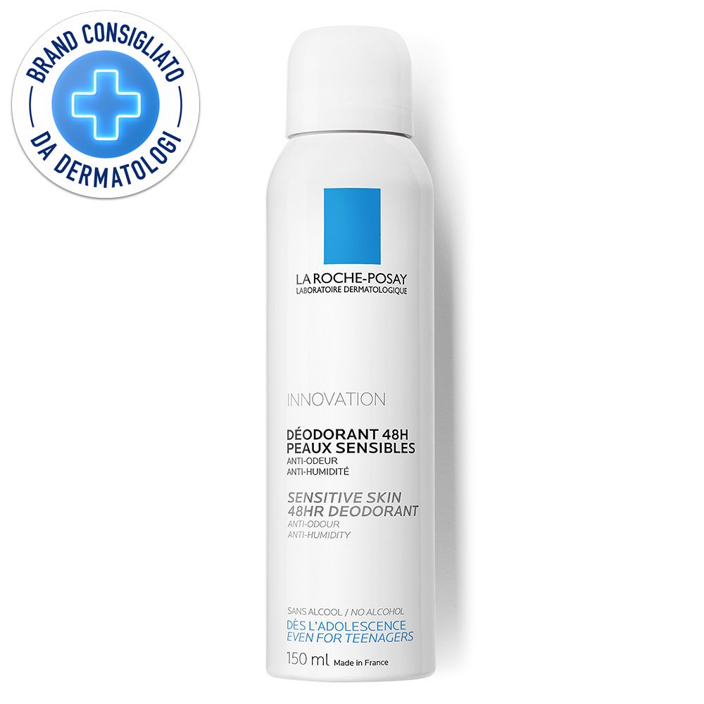 Spray deodorante bianco con logo blu e testo. Scritta: Deodorant 48h Peaux Sensibles. Sigillo: Brand Consigliato da Dermatologi.