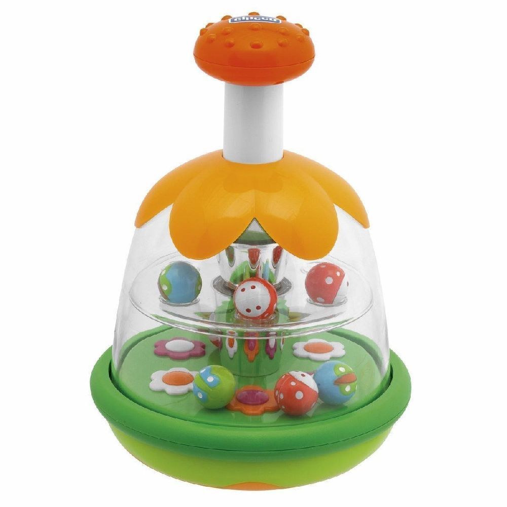 Trottola giocattolo con palline e fiori colorati. Cupola trasparente, fiore arancione, base verde.