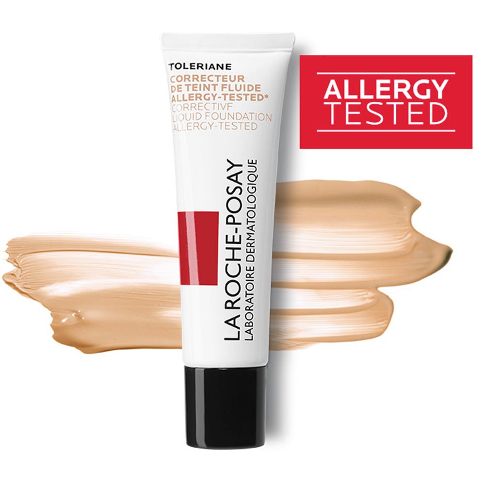 Tube blanc et rouge avec bouchon noir et taches de couleur. Inscription: Toleriane, Correcteur de Teint Fluide, Allergy-Tested. Marque: La Roche-Posay.
