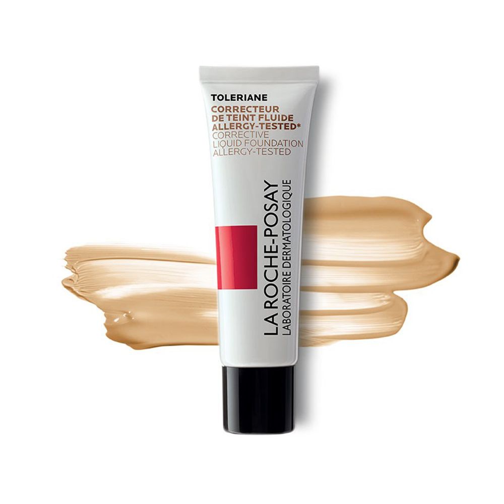 Tubo bianco con tappo nero e colore trucco. Scritta: Toleriane, Correcteur de Teint Fluide, Allergy-Tested. Striscia rossa e logo.