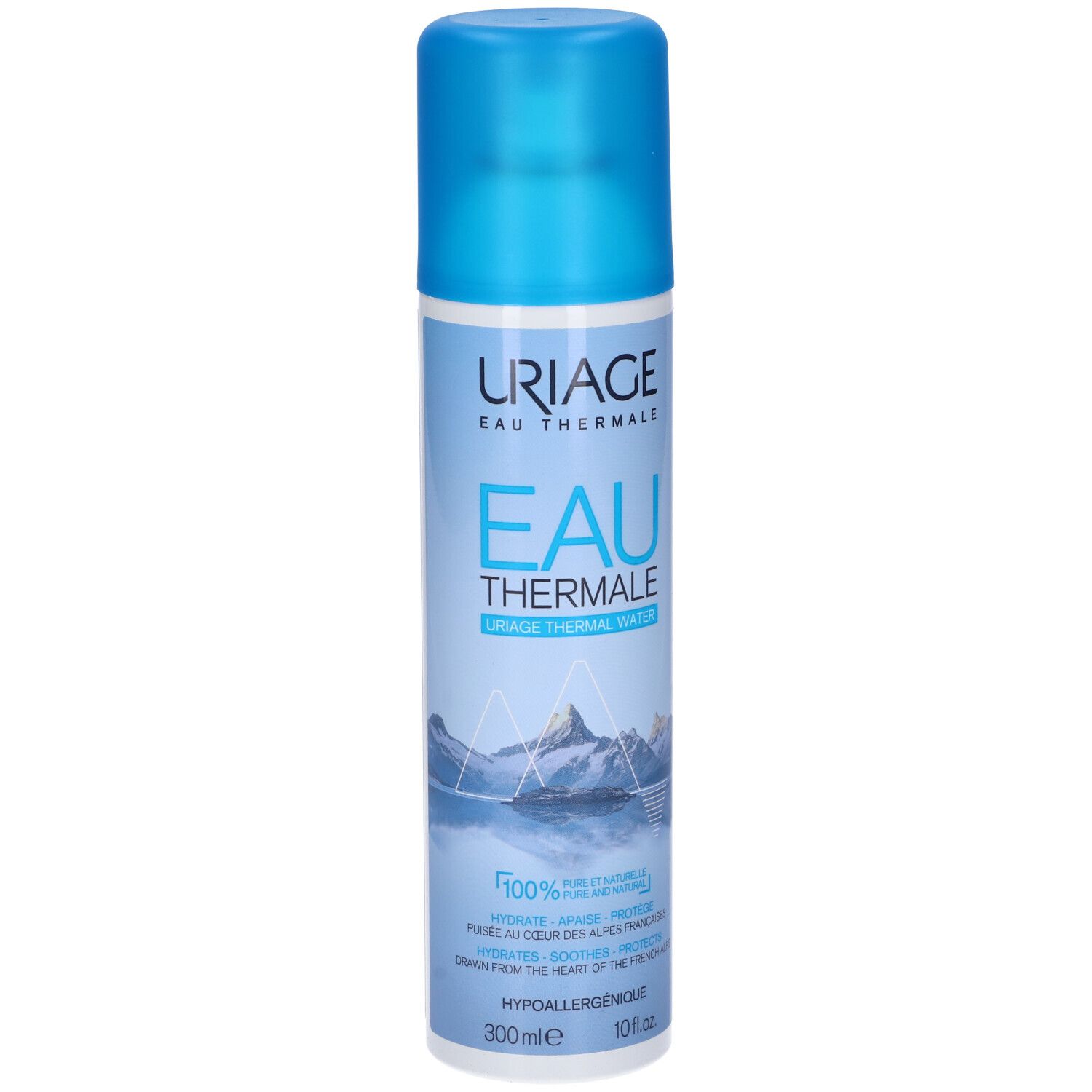 Spray Uriage Eau Thermale. Flacone blu con etichetta bianca. Montagne e testo.