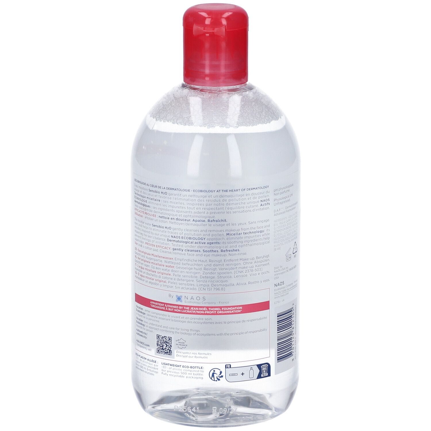 Klare Flüssigkeit in durchsichtiger Flasche mit rotem Klappdeckel. Etikett mit Produktinformationen.
