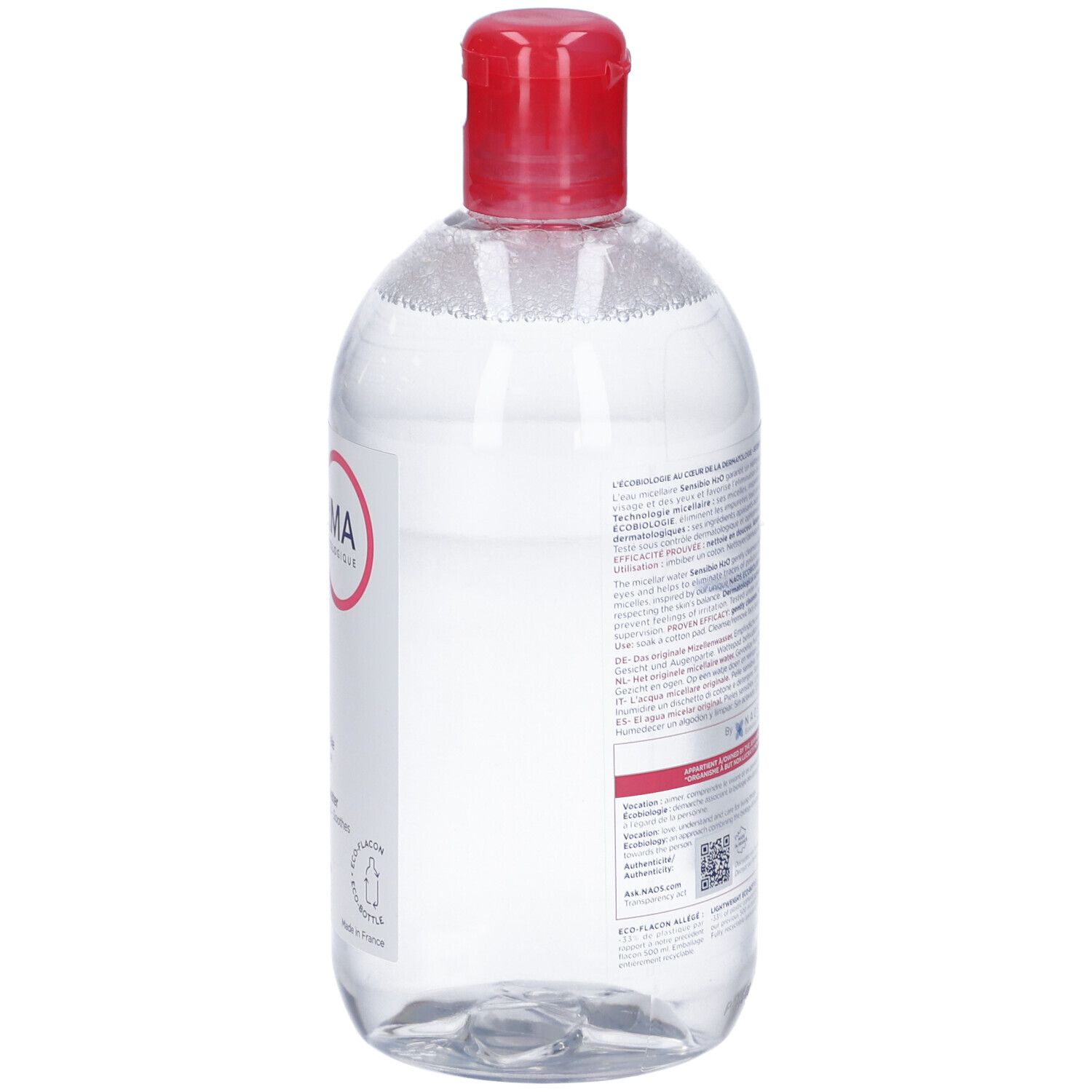 Klare Flüssigkeit in durchsichtiger Flasche mit rotem Klappdeckel. Etikett mit Text und Logo.