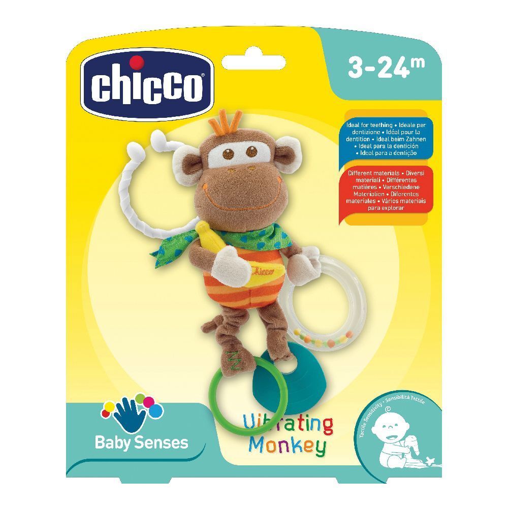 Giocattolo scimmia Chicco. Scimmia di stoffa marrone con anello e banana. Confezione con nome del prodotto e fascia d'età.