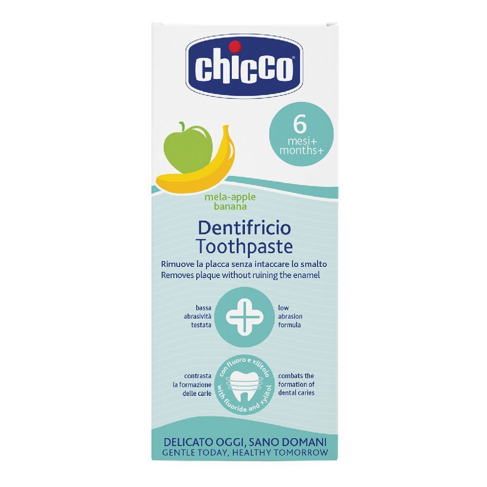 Emballage de dentifrice avec illustrations de pomme et banane. Texte : '6 mesi+', 'Dentifricio Toothpaste'.