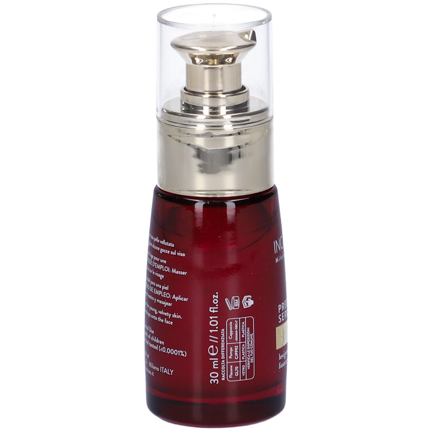Rote Glasflasche mit silbernem Pumpkopf. Aufschrift: 30 ml, PRECIOUS SERUM. Rückseite mit Text in mehreren Sprachen.