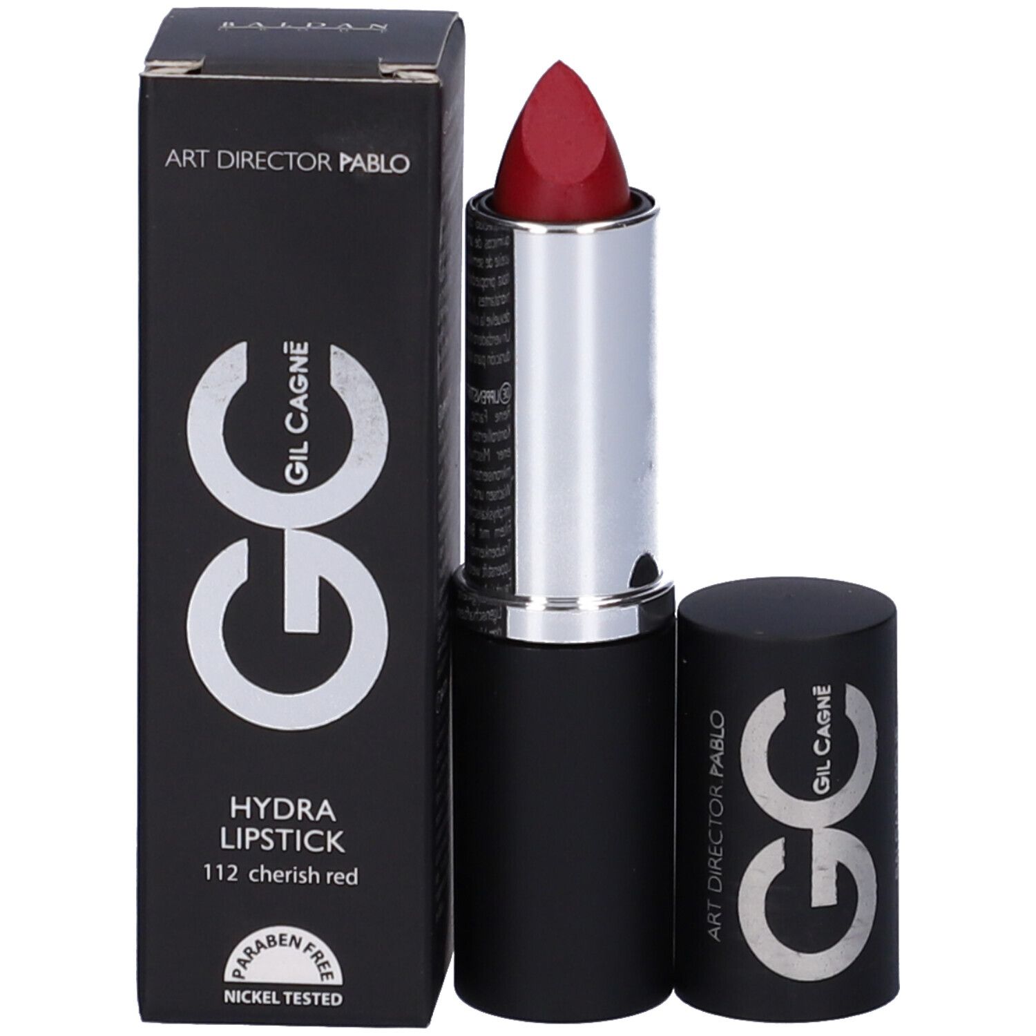 Rossetto rosso con astuccio nero e anello argentato. Confezione con scritta e logo. Aperto.
