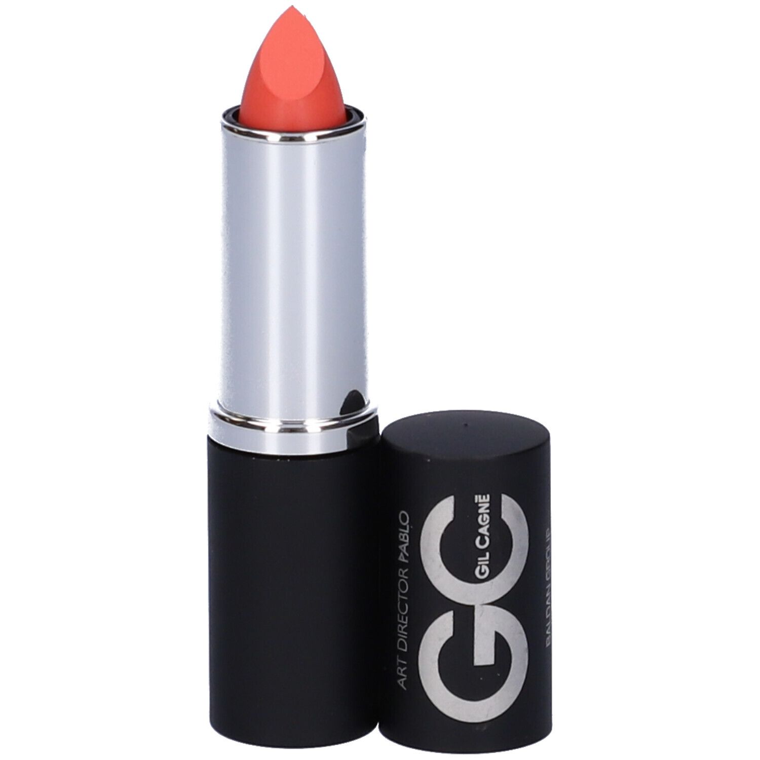 Rossetto corallo. Stick nero con anello argentato. Tappo accanto.