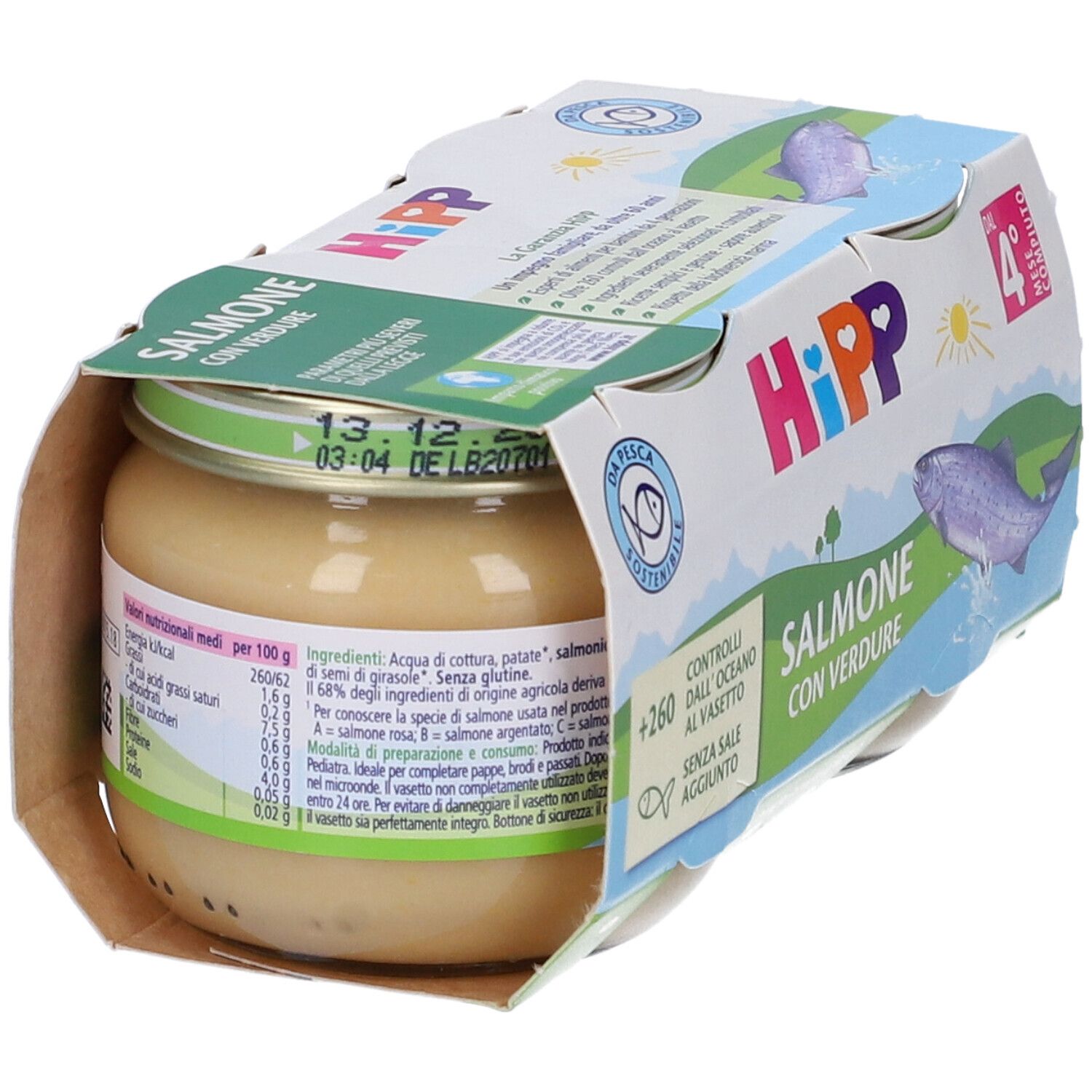 Hipp Omogen, Glas mit Lachs und Gemüse. Verpackung mit Produktinformationen. Haltbarkeitsdatum sichtbar.