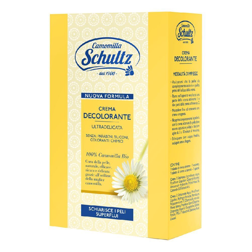 Scatola gialla con stampa del prodotto. Scritto: Crema Decolorante, Camomilla Schultz. Illustrazione di un fiore di camomilla.