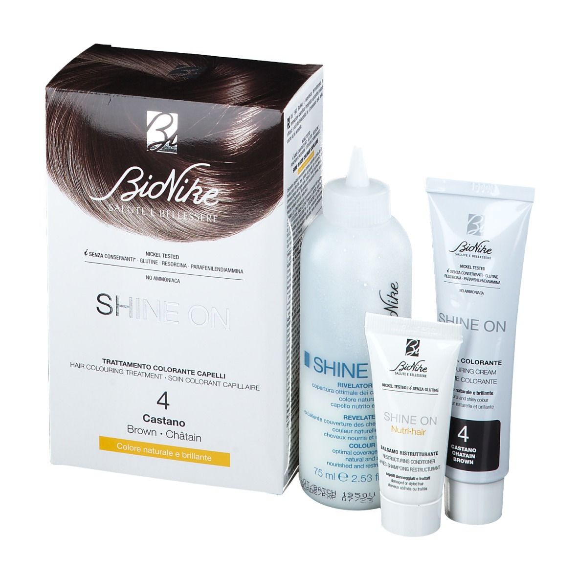 BioNike Shine On, confezione di tintura per capelli e accessori. Include flacone, tubi e confezione. Nome del prodotto e colore ben visibili.