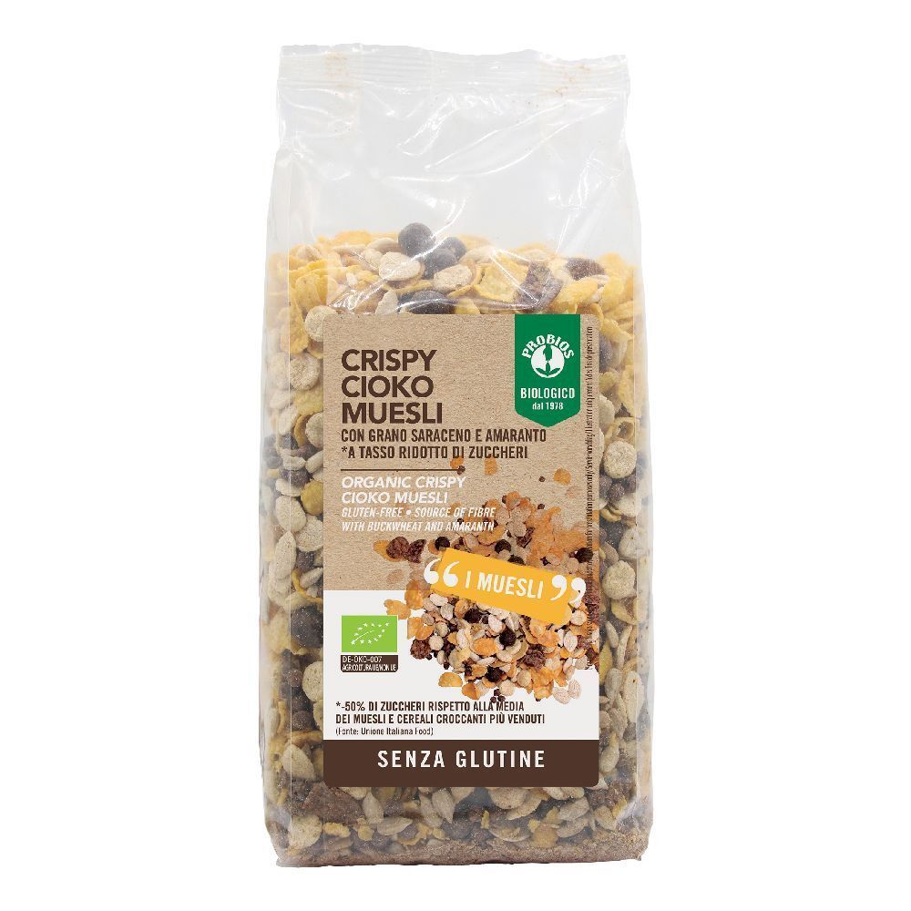 Confezione trasparente di muesli. Scritta: CRISPY CIOKO MUESLI, senza glutine, marchio biologico. Testo: « A tasso ridotto zuccheri ».