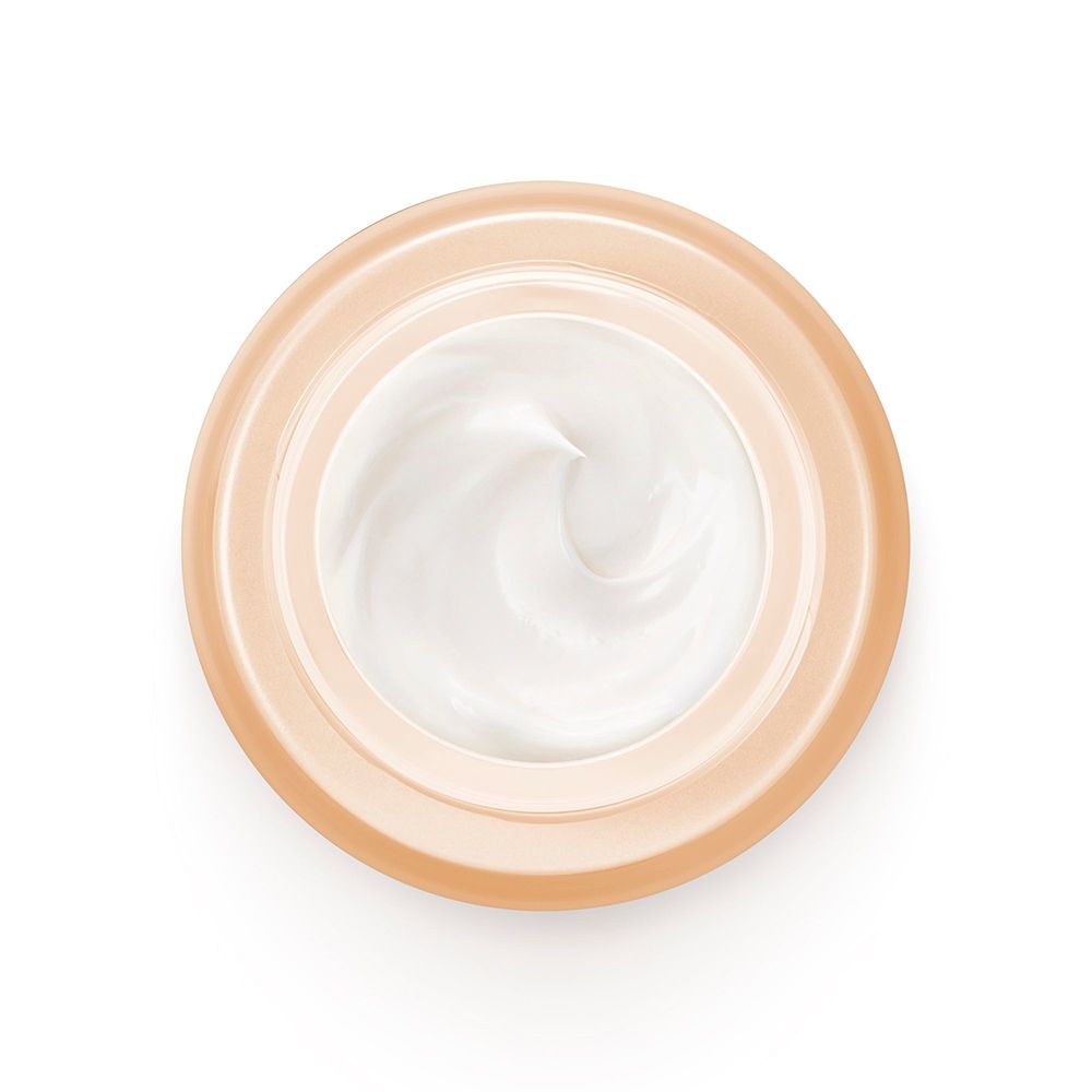 Cremebehälter, von oben. Creme-Textur. Beige-farbener Behälter.