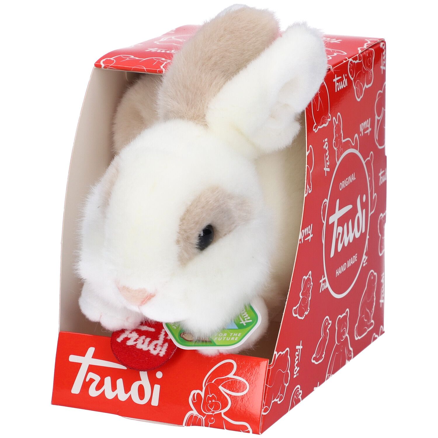 Coniglio di peluche bianco e marrone in scatola rossa. Sulla scatola c'è scritto "Trudi".