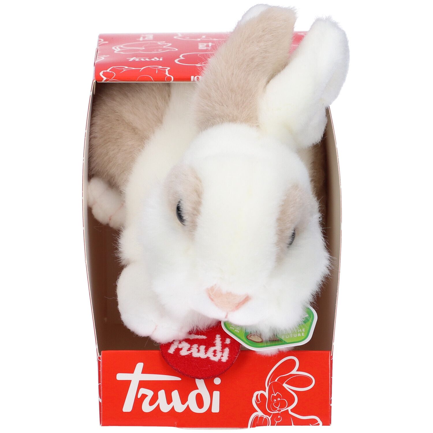 Coniglio di peluche bianco e marrone in scatola rossa. Sulla scatola c'è scritto "Trudi".