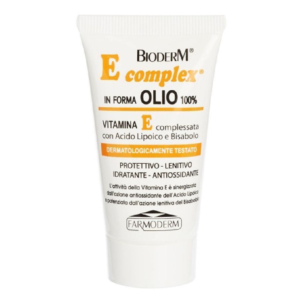 Tubo bianco con dettagli gialli. Scritta: Bioderm E complex, Olio 100%. Contiene vitamina E, dermatologicamente testato.