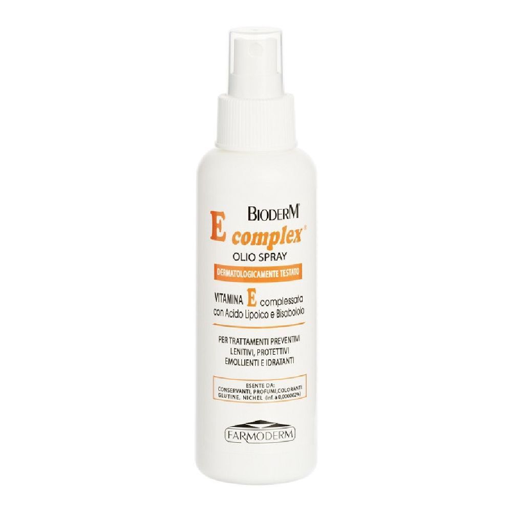 Flacone spray bianco con etichetta arancione. Testo: Bioderm E complex, Olio Spray, Vitamina E, con acido lipoico e bisabololo.