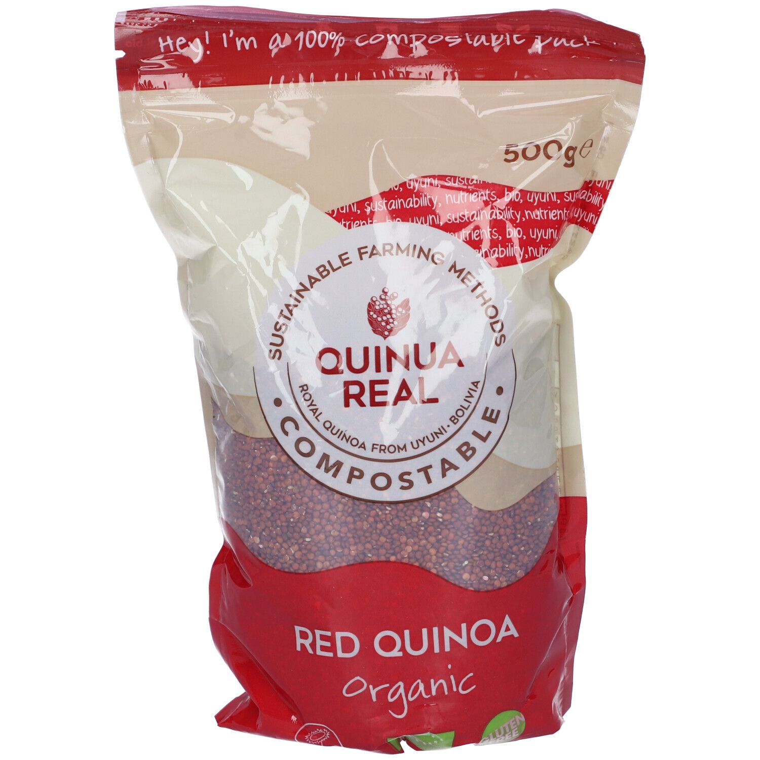 Sacchetto di Quinua Real. Quinoa rossa biologica. Scritta 'Compostable'. 500g. Metodi agricoli sostenibili. Sacchetto rosso, vista trasparente.