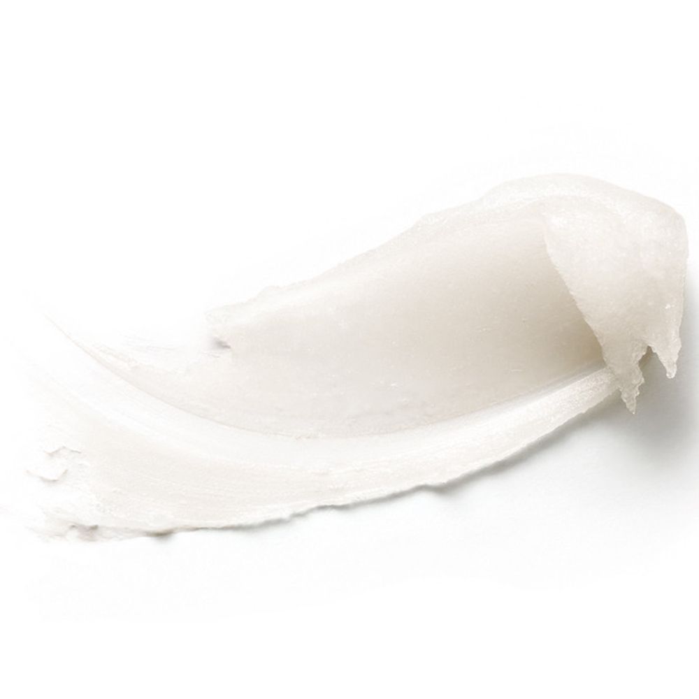 Striscio di balsamo labbra bianco su sfondo bianco.