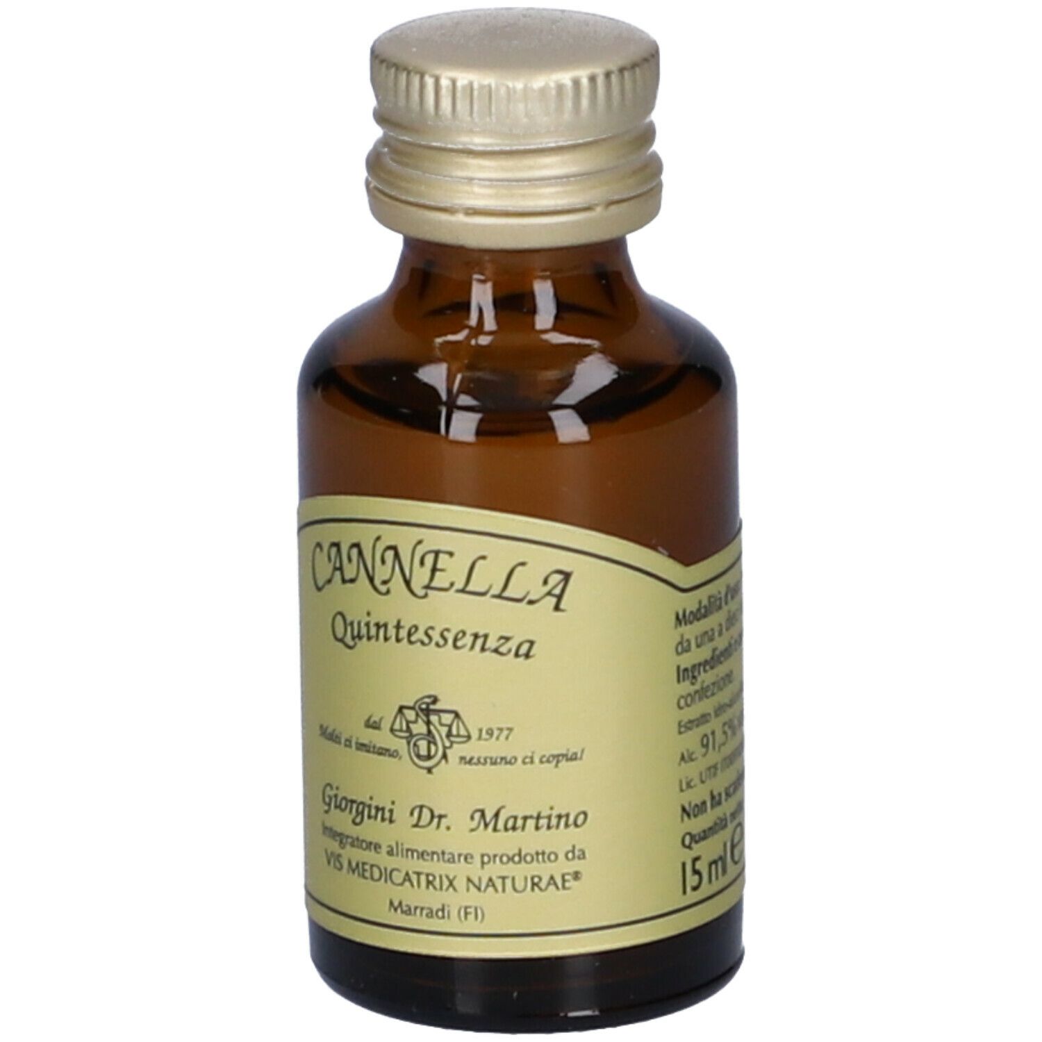 Flacone in vetro marrone con tappo dorato. Etichetta con informazioni. Scritta: Cannella Quintessenza. Marchio: Giorgini Dr. Martino.