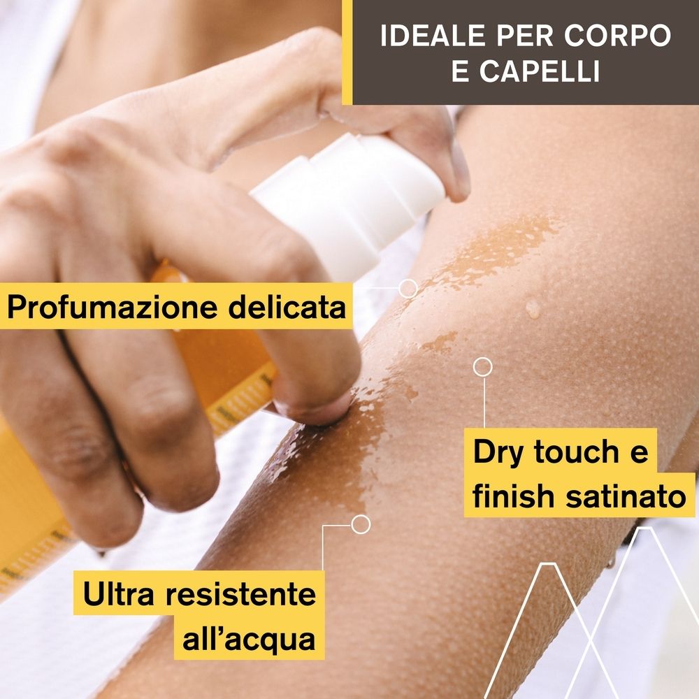 Braccio con Uriage Bariésun Olio Secco SPF 30. Olio applicato. Testo: « Ultra resistent all'acqua ».