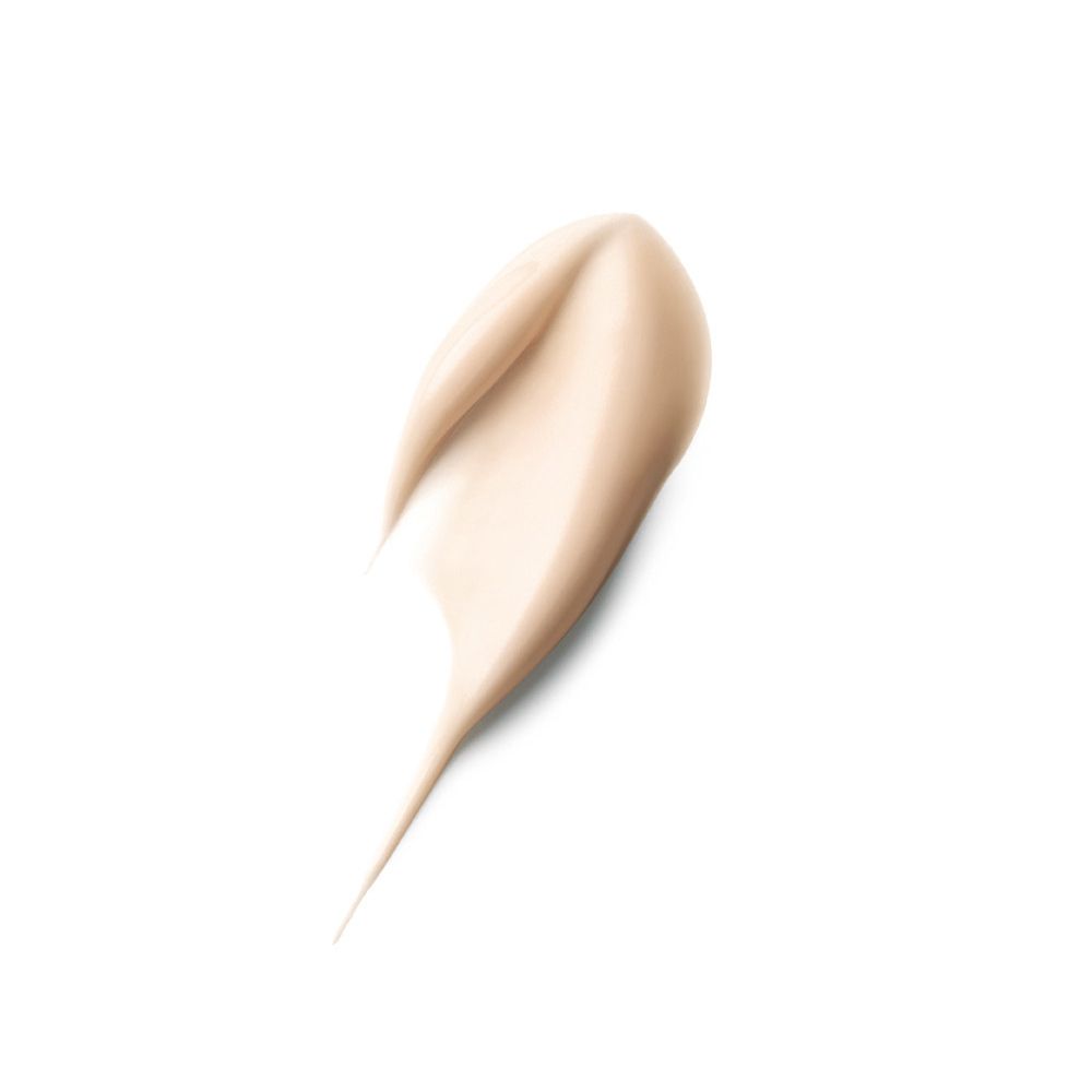 Crema spalmata, beige chiaro. Forma: a goccia, con estremità appuntita. Su sfondo bianco.