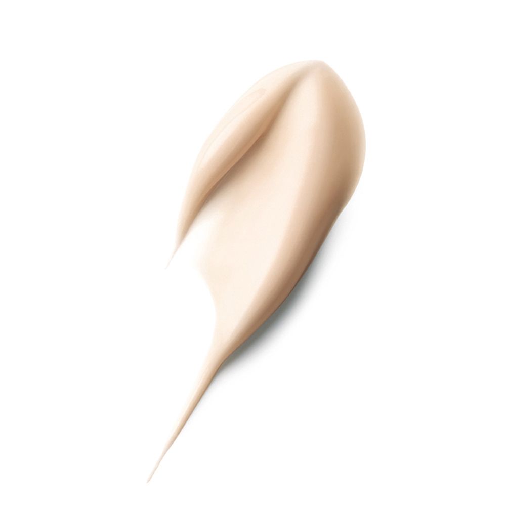 Crema spalmata, beige chiaro. Forma: a goccia, con estremità appuntita. Su sfondo bianco.