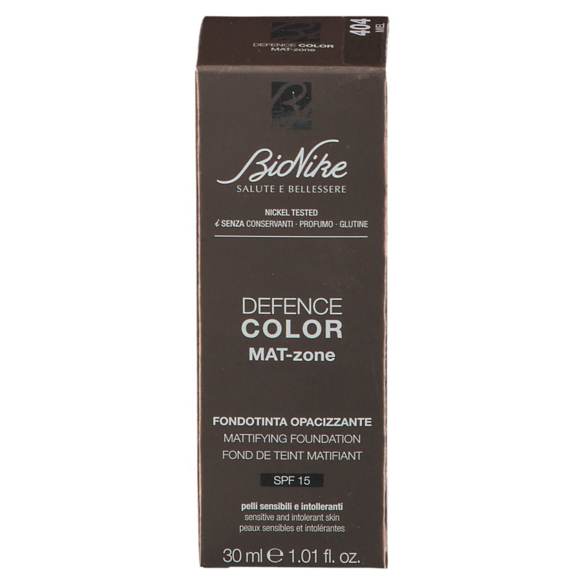 Confezione marrone. Scritta: Defence Color Mat-zone, SPF 15. Marchio: BioNike. Parte anteriore.