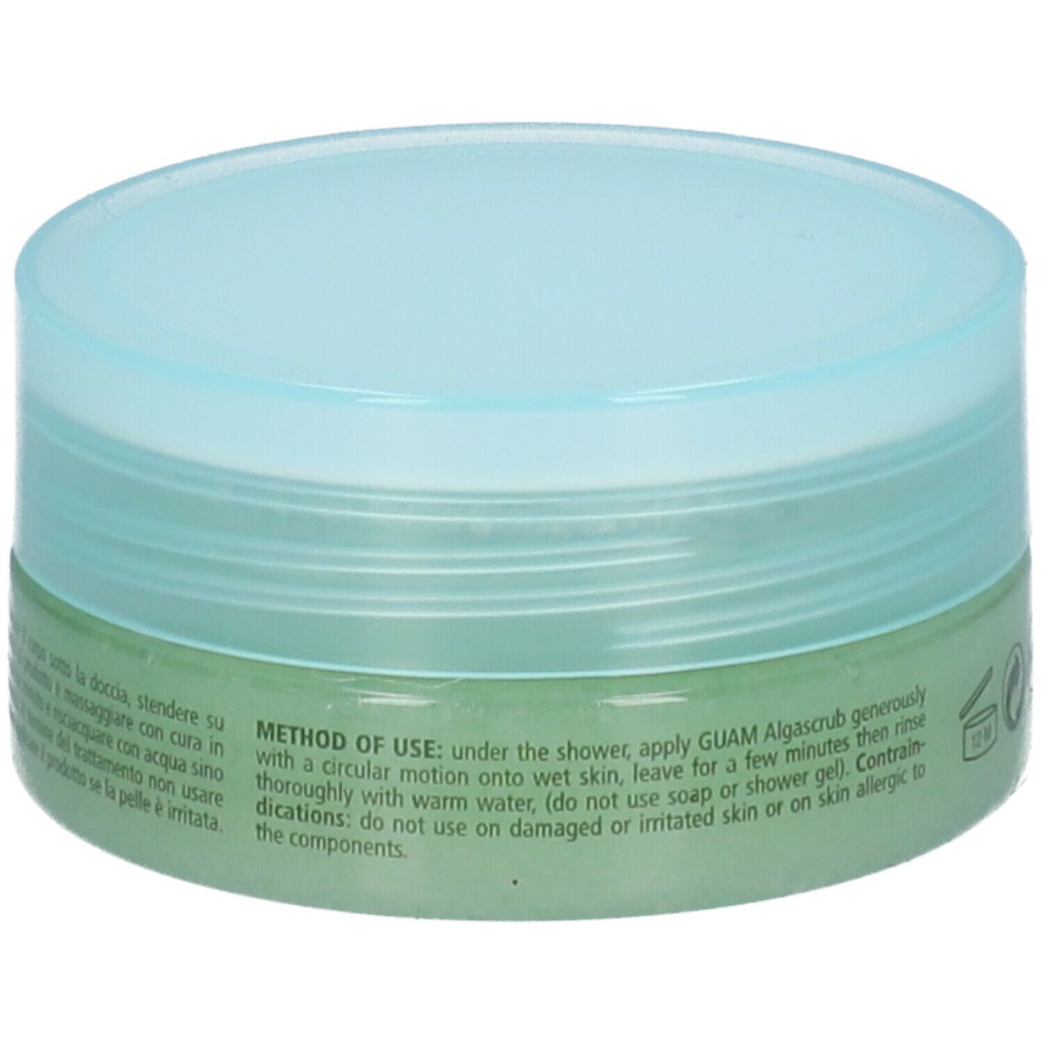 Vaso rotondo di GUAM Algascrub. Contenuto verde, coperchio blu. Testo: Modalità d'uso. Non usare su pelle irritata.