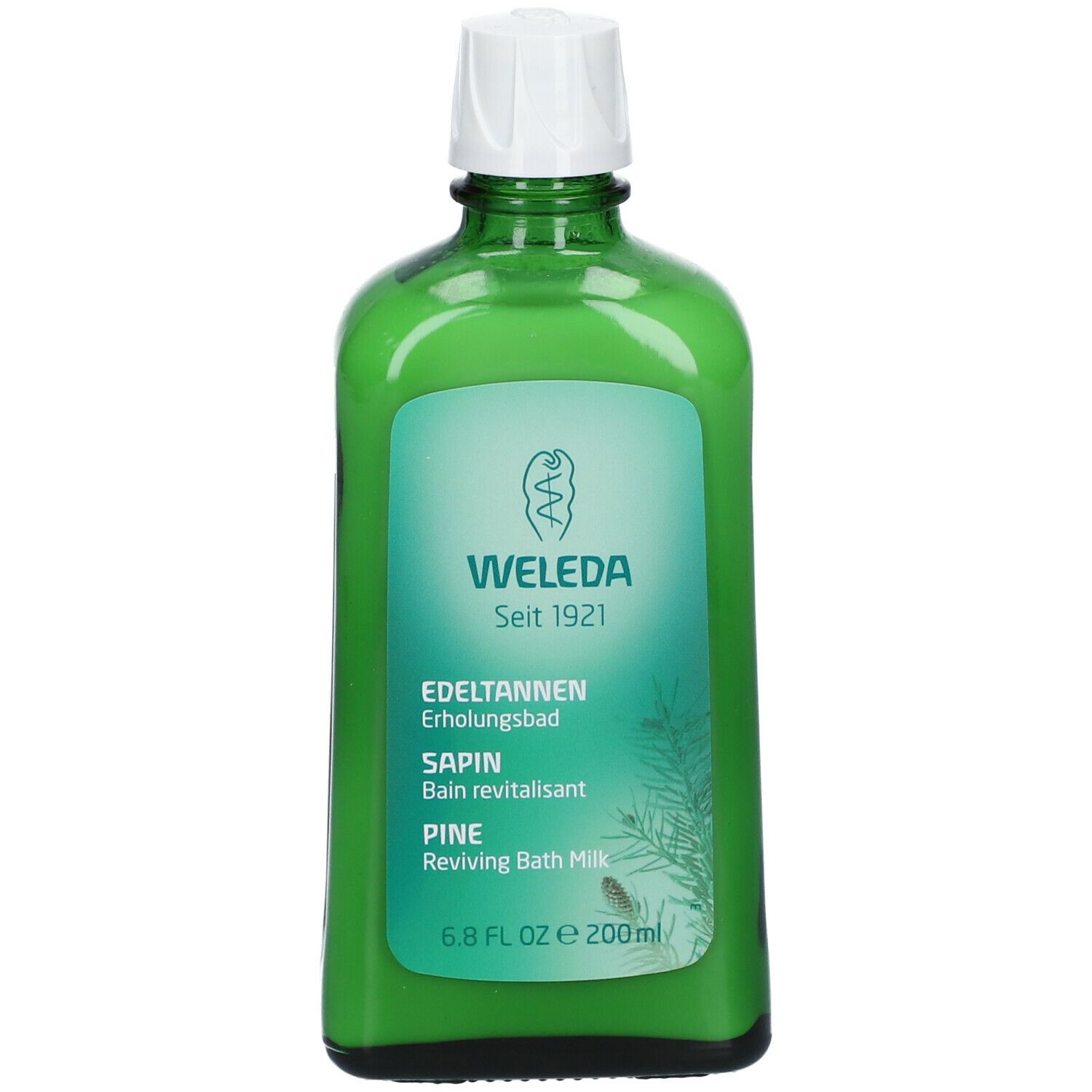 Bottiglia di vetro verde con tappo bianco. Nome e logo del prodotto visibili. Testo in tedesco, francese, italiano e inglese. "Weleda" e "Edeltannen Erholungsbad".