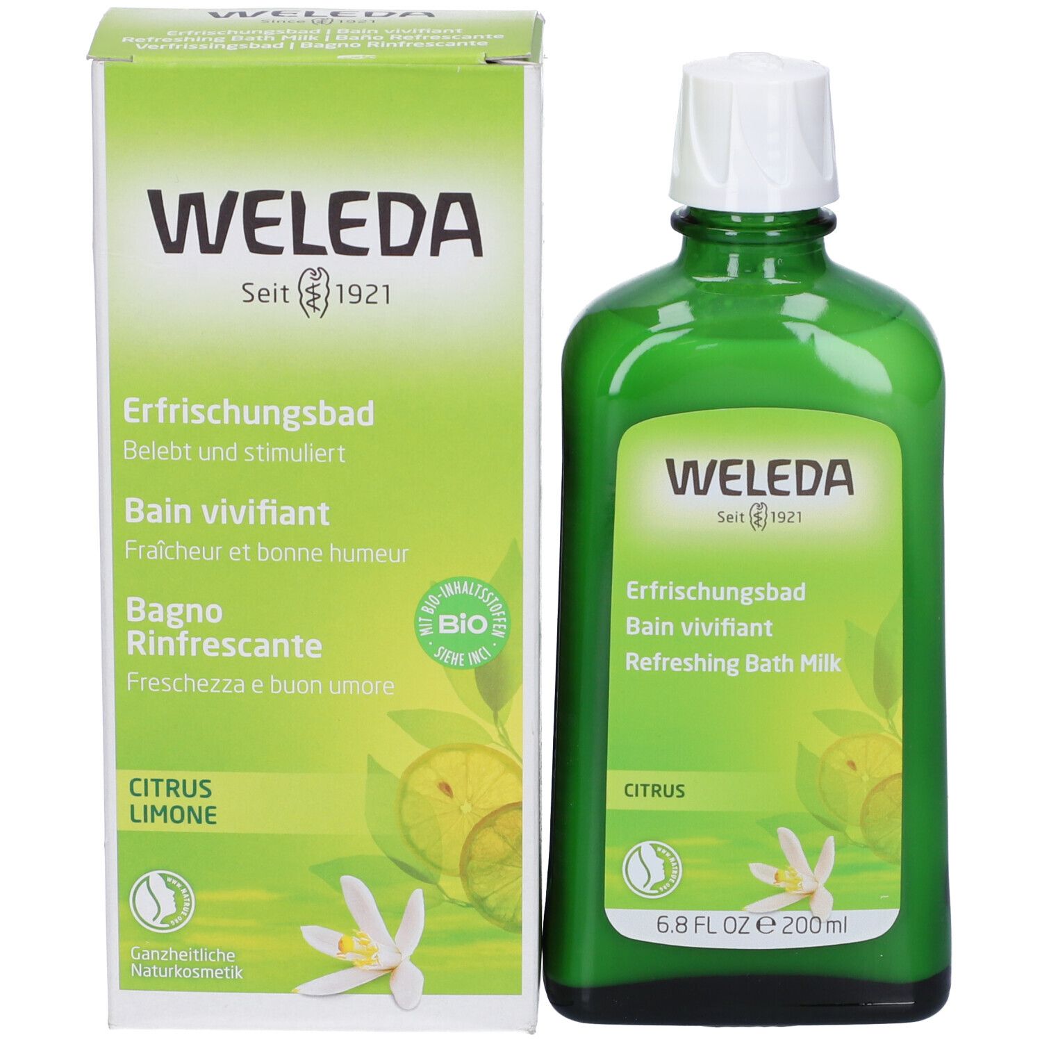 Prodotto e confezione affiancati. Bottiglia verde e scatola con nome del prodotto, marchio Weleda e illustrazione di limone.