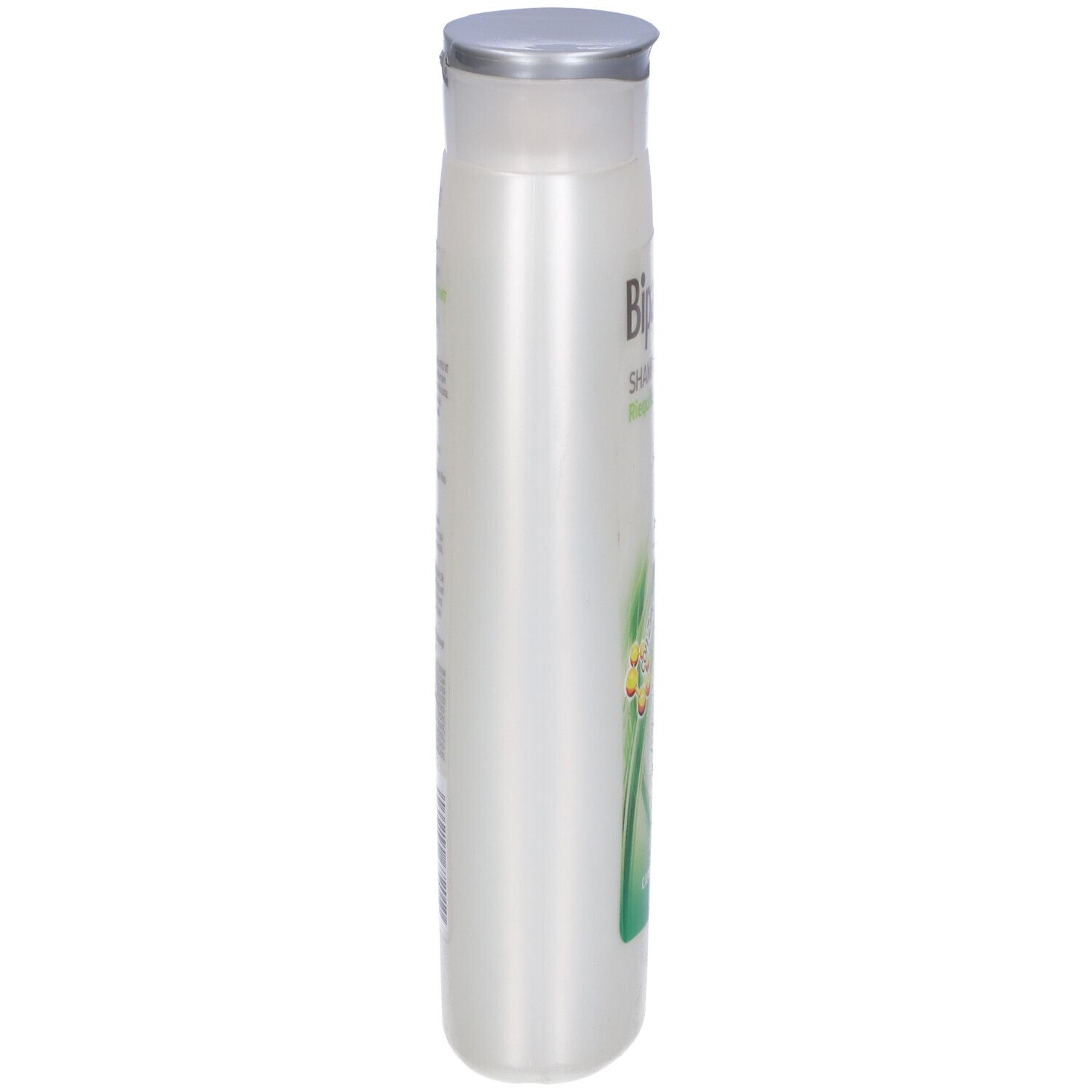 Flacone di shampoo, vista laterale. Bianco, con tappo argentato. Etichetta con testo.
