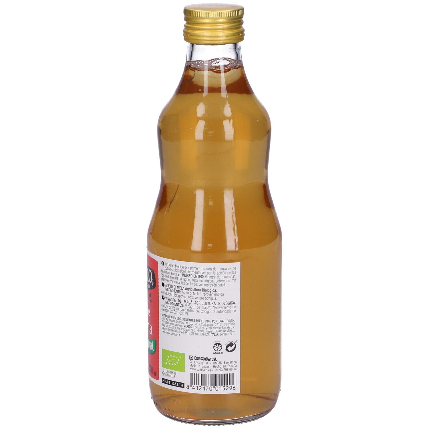Bottiglia di vetro con liquido giallo. Tappo dorato. Etichetta rossa con testo: Vinagre de manzana.