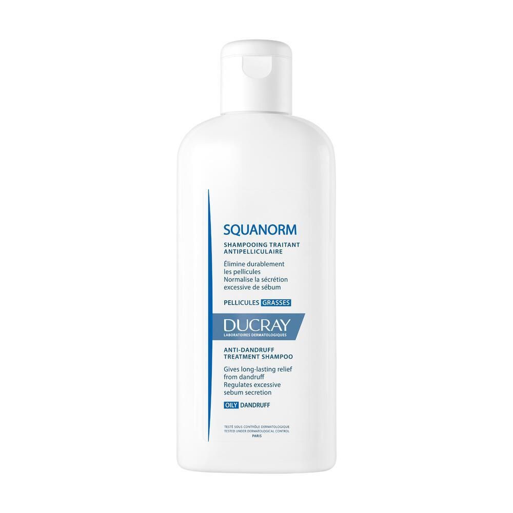 Flacon blanc avec étiquette bleue. Texte : SQUANORM, shampooing antipelliculaire, DUCRAY.