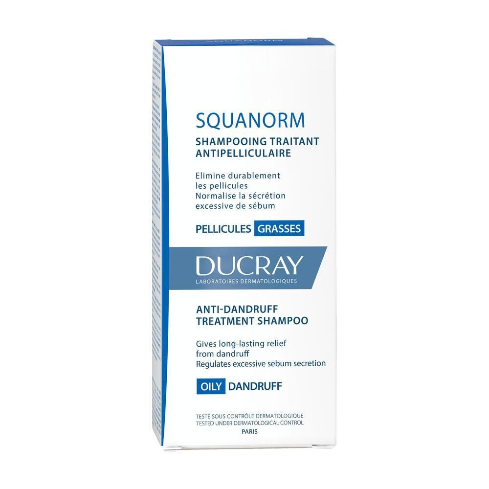 Boîte blanche avec étiquette bleue. Texte : SQUANORM, shampooing antipelliculaire, DUCRAY.
