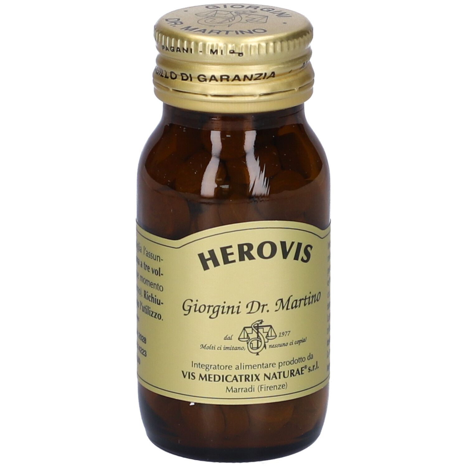 Bottiglia di vetro marrone con tappo dorato ed etichetta. Etichetta con informazioni sul prodotto, ingredienti e dosaggio. Compresse visibili.