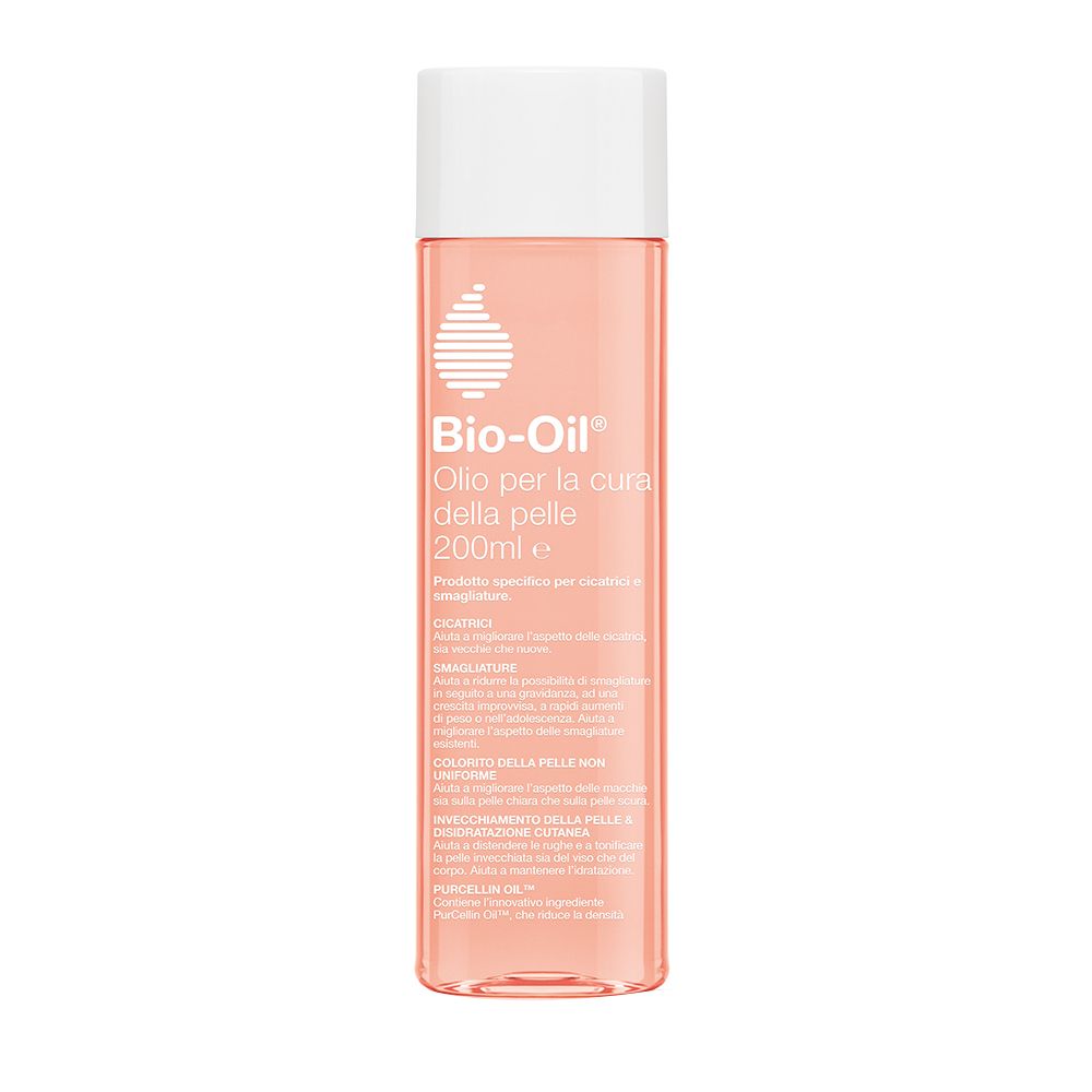 Bio-Oil® olio per la cura della pelle, flacone trasparente con tappo bianco. Liquido rosa. Etichetta del prodotto con testo in italiano.