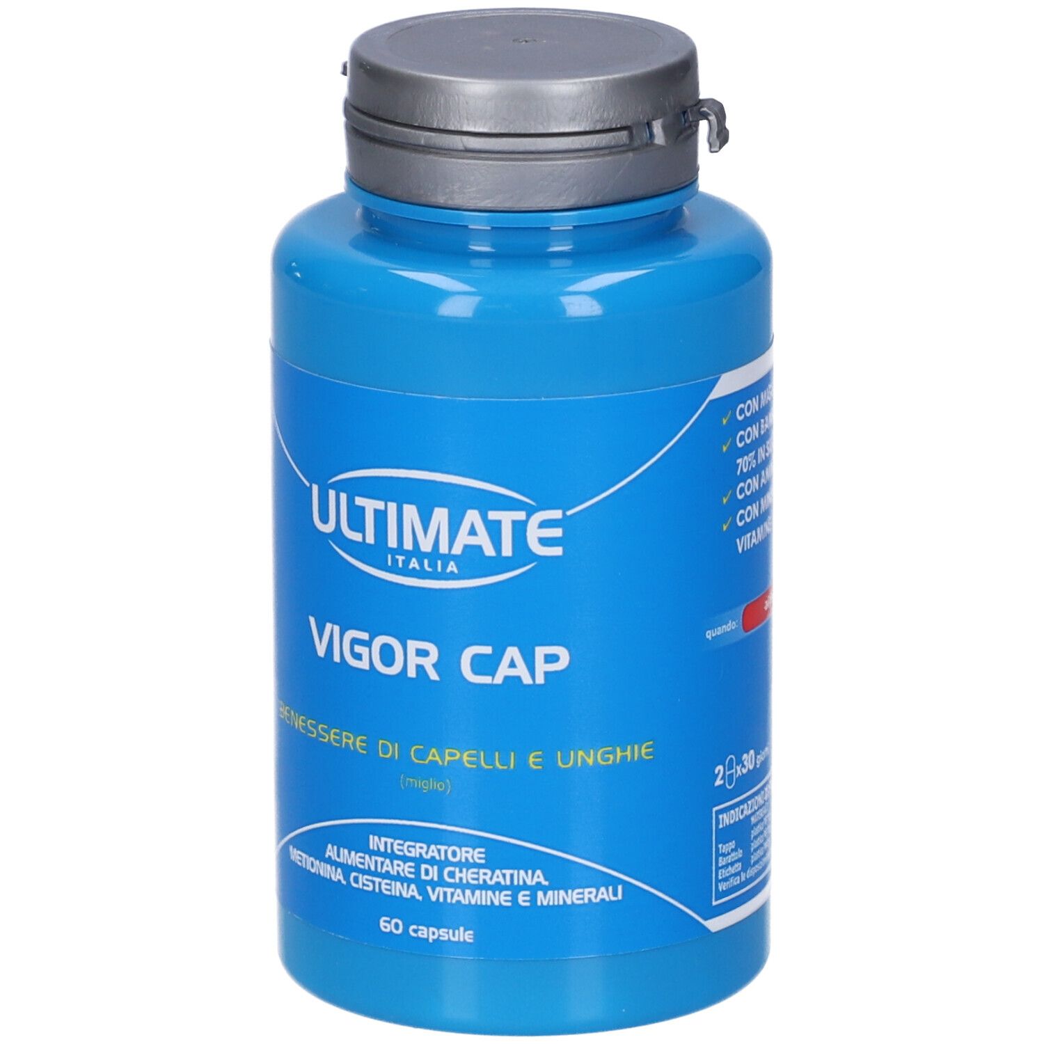 Flacone blu con capsule. Scritta: ULTIMATE, VIGOR CAP, BENESSERE DI CAPELLI E UNGHIE. 60 capsule.