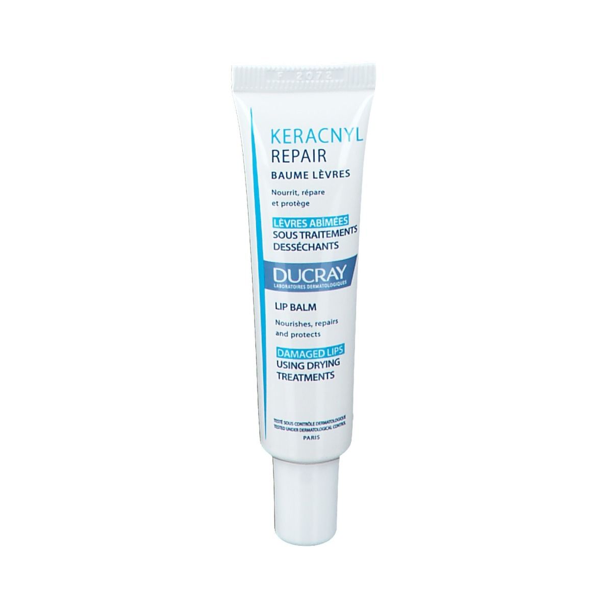 Weiße Tube Ducray Keracnyl Repair Lippenbalsam. Blaues Logo und Text. Für trockene Lippen.