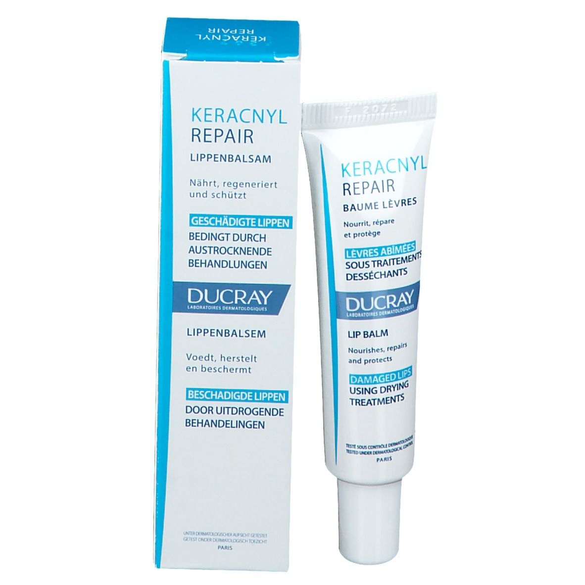 Ducray Keracnyl Repair Lippenbalsam in Schachtel und Tube. Weiß und blau. Für trockene Lippen.