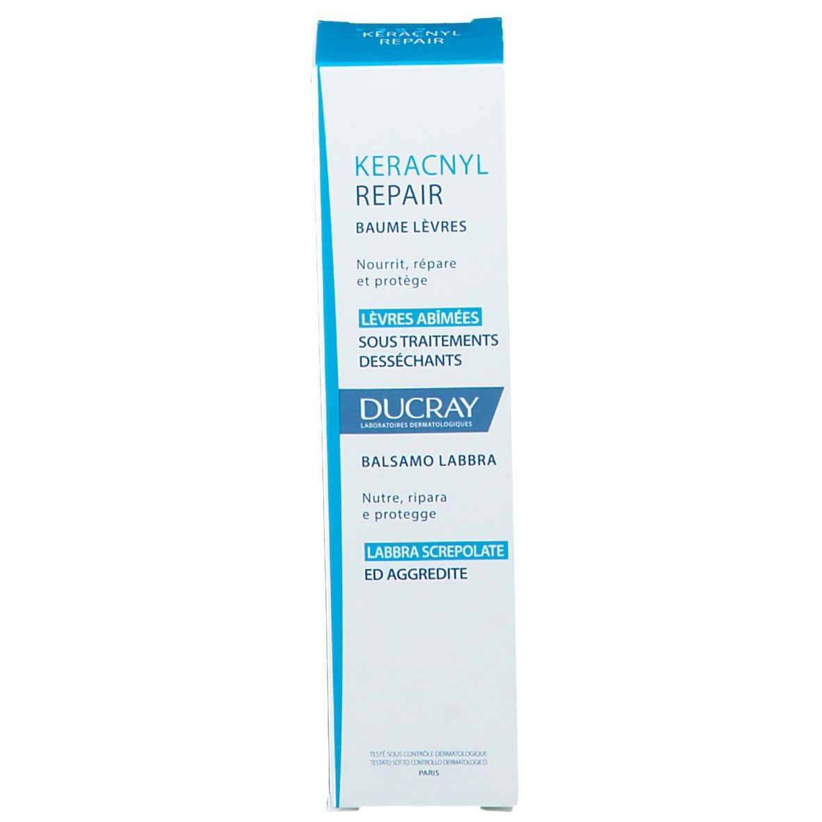 Rückseite der Schachtel Ducray Keracnyl Repair Lippenbalsam. Text in mehreren Sprachen. 15ml.