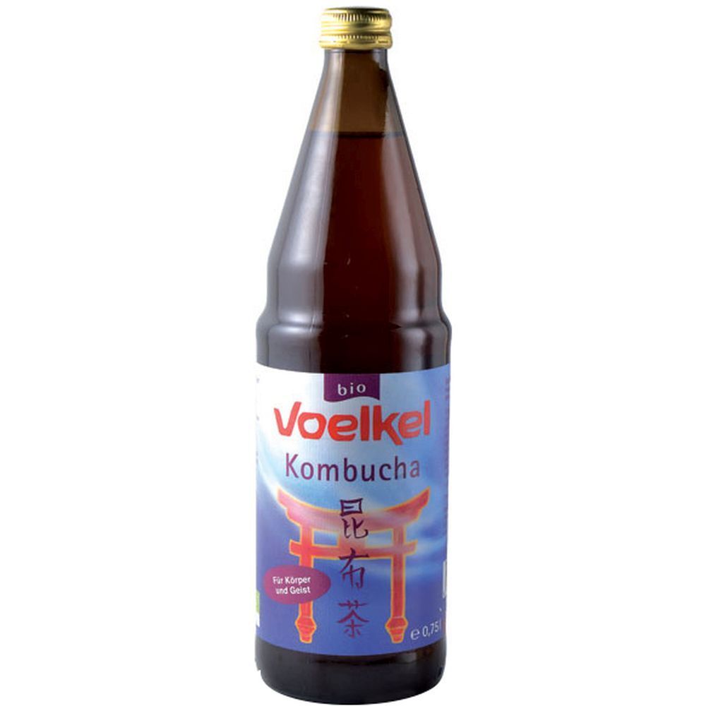 Bottiglia di vetro marrone con tappo dorato. Etichetta "Voelkel Kombucha", caratteri giapponesi e "bio".