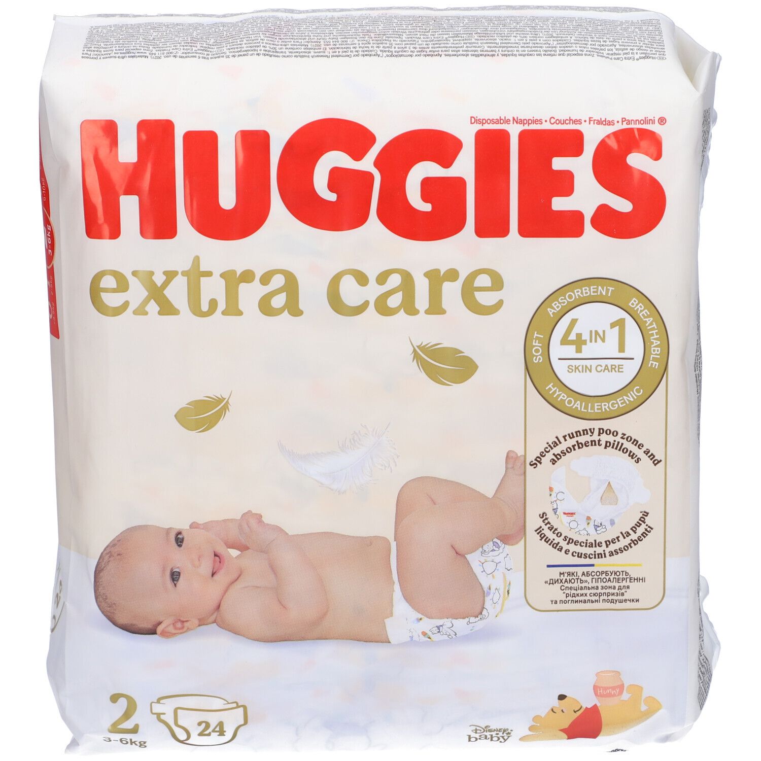 Confezione di pannolini Huggies Extra Care Taglia 2. Scritta 4-in-1, ipoallergenico. Bambino sul pannolino.