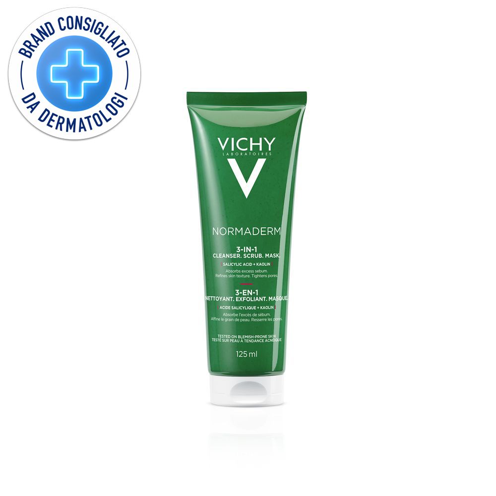Tubo verde con tappo bianco. Logo Vichy e nome del prodotto. Scritta: 3-in-1 Cleanser, Scrub, Maske. Sigillo: Brand Consigliato da Dermatologi.